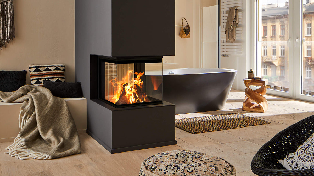 Three-sided glass wood fireplace in a modern column, warm living space – Haddad Fireplace